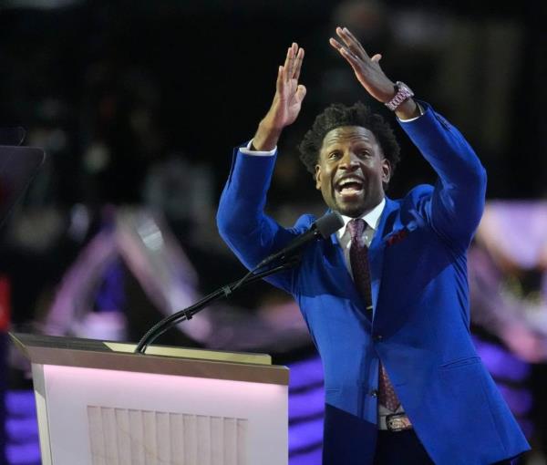 Pastor Lorenzo Sewell, in a blue suit, speaking at the final day of the Republican Natio<em></em>nal Co<em></em>nvention at the Fiserv Forum