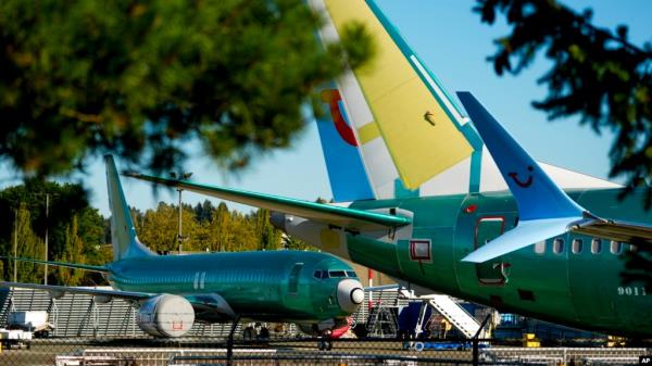 FILE - Unpainted Boeing 737 Max aircraft are seen at the company's facilities in Renton, Washington, Sept. 24, 2024. Boeing plans to lay off a<em></em>bout 10% of its workers in coming months.