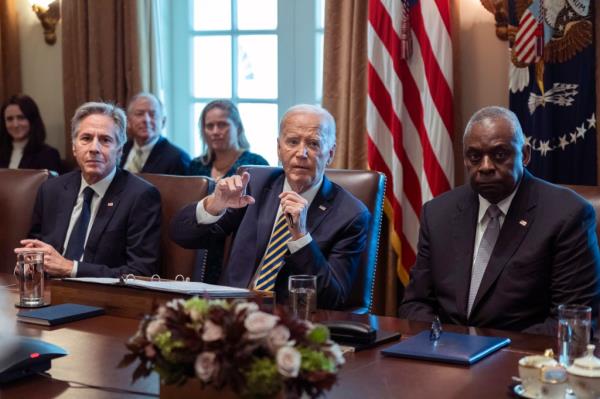 President Joe Biden speaking in a White House meeting, flanked by Secretary of State Antony Bl<em></em>inken and Secretary of Defense Lloyd Austin with Jill Biden present