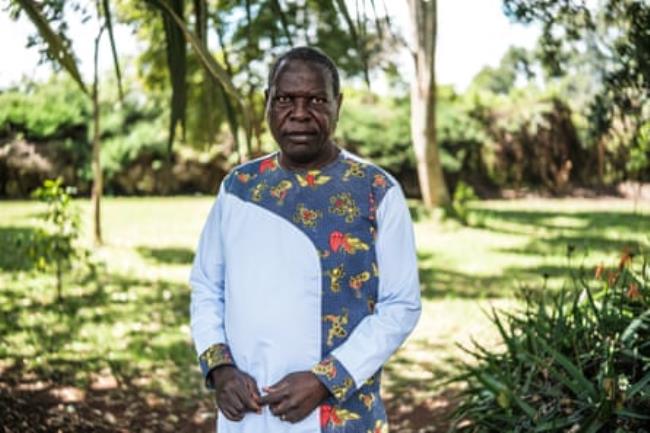 Portrait of Desterio Nyamo<em></em>ngo standing outside in a garden